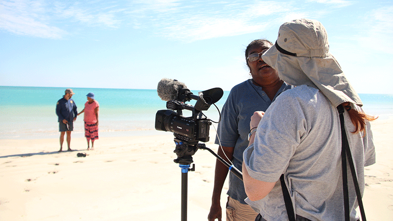 Interview on beach with camera crew